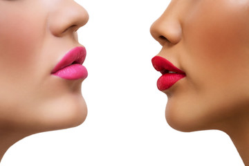 two beautiful ladies with sensual red, pink lips. Dark and light skin women opposite each other on...