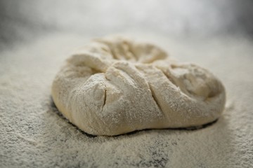 Close up of flour on kneaded dough
