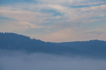 Obraz na płótnie Canvas Foggy morning in the Ukrainian Carpathian Mountains in the autumn season