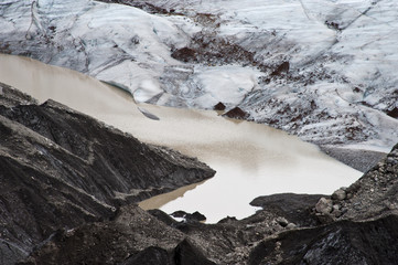 Hiking in Skaftafell, typical Icelandic landscape, a wild nature of rocks and shrubs, rivers and lakes.