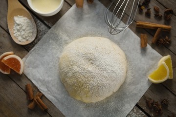 High angle view of kneaded dough amidst various ingredients