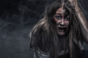 Zombie woman, Horror background for halloween concept and book cover. Copy space.