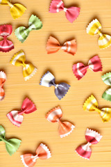 Colored raw macaroni. Vegetarian food. Italian restaurant food.Cover for the cookbook.