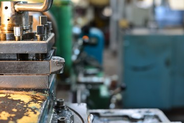 Professional machinist. Horizontal shot of a man operating lathe grinding machine metalworking industry concept copyspace