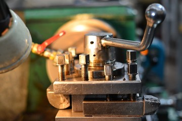 Professional machinist. Horizontal shot of a man operating lathe grinding machine metalworking industry concept copyspace