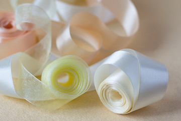 ribbon roles on a fabric close up image