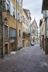 Fototapeta na wymiar Street leading to Saint Laurent Church in Aubenas in France