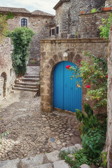 Obraz na płótnie Canvas The narrow street in the picturesque village of Lanas in the Ardèche region