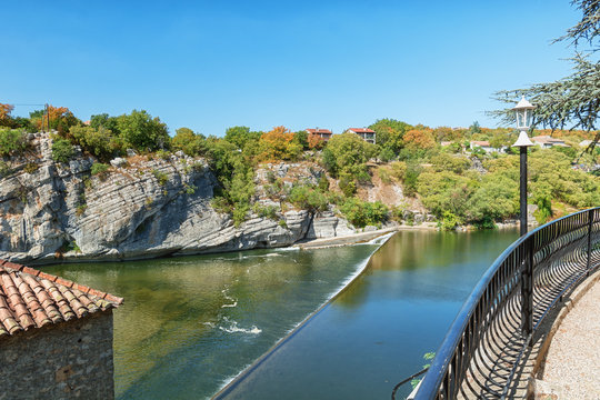 Weir in the Ardeche River near the village of Ruoms in the Ardeche region in France
