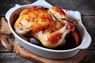 Delicious baked chicken with apples and plums.