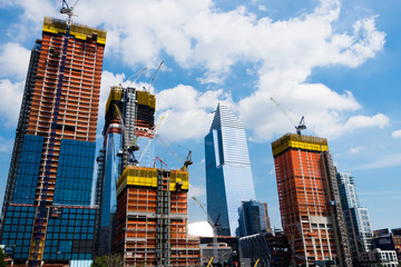 New York construction places. New buildings in process with Scaffolds