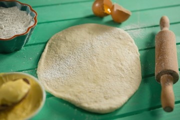 High angle view of dough with ingredients