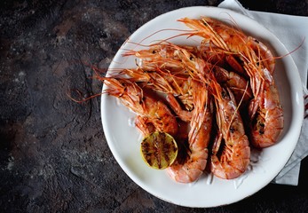 Grilled shrimp with garlic, soy sauce, olive oil, ginger and chili pepper. Top view.