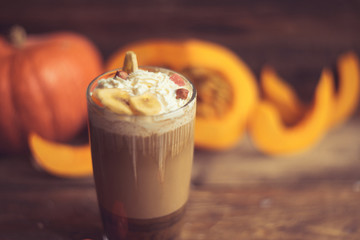 Pumpkin spice latte with whipped cream and caramel
