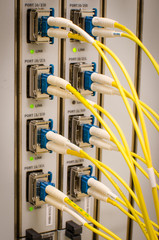 Optic fiber cables connected to an optic switch