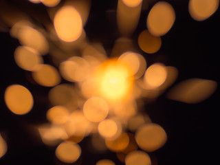 The stream of a bright sparks on the blurry background