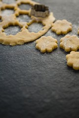 Close up of flower shape pastry cutter on dough