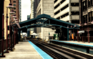 Naklejka premium Metro station surrounded by buildings at The Loop - Sepia Glow Artistic Effect - Chicago, CHI, Illinois, USA