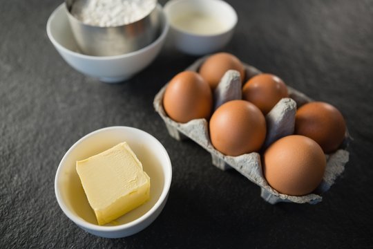 High angle view of butter and eggs on table