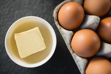 Close up of butter in bowl by egg carton © WavebreakMediaMicro