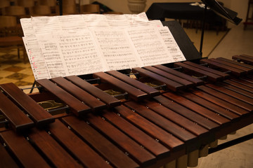 Wooden xylophone with sheet music