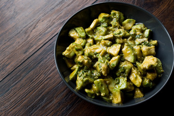 Organic Green Avocado Salad with Mustard in bowl.