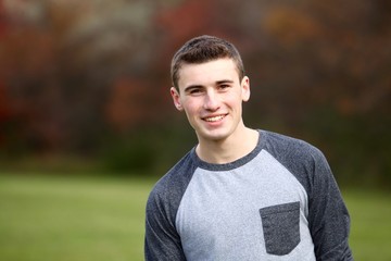 Portrait head shot of a teenage boy outdoor