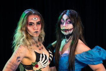 What Lies Beneath Female Model with custom special effects makeup on a stage with theatrical lighting. Halloween and horror themed