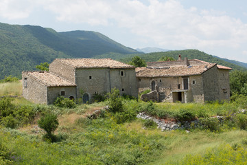Fototapeta na wymiar Ancient restored houses in an abandoned mountain village, Central Italy 