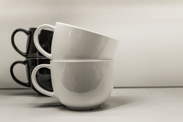 Two mugs on a white background are standing.