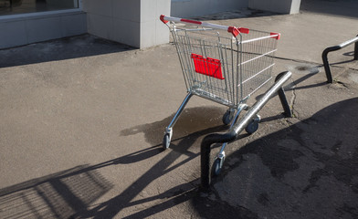 Trolley for products in the car park near the supermarket
