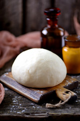 Fototapeta premium Dough with yeast from wheat flour with olive oil for pizza and homemade bread.