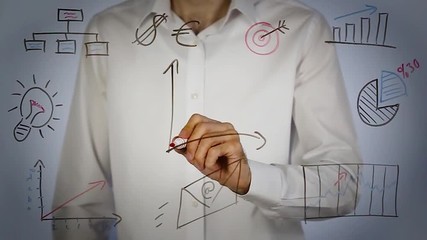 man drawing growth chart and writing strategy on transparent screen