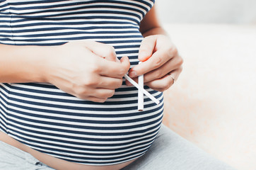 pregnant girl with cigarettes