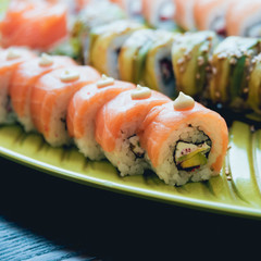 Sushi and rolls with salmon, prawn, avocado, cream cheese. Sushi menu. Japanese food.