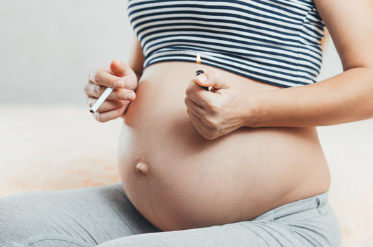 pregnant girl with cigarettes