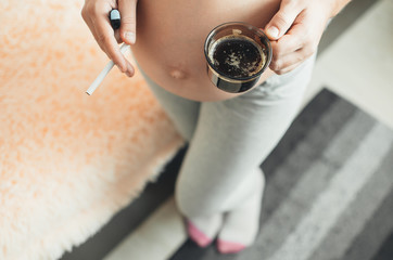 pregnant girl with cigarettes and coffee