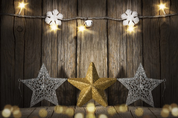 Fototapeta na wymiar Christmas vintage ornaments, stars on wood , lights bokeh 