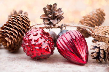 Christmas cone with red berries on a bokeh background.