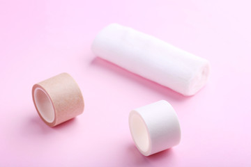 Medical plasters on pink background