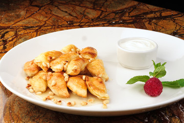 Dumplings, pelmeni, ravioli - On a white plate
