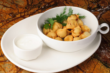 Dumplings, pelmeni, ravioli - On a white plate