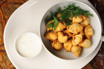 Dumplings, pelmeni, ravioli - On a white plate