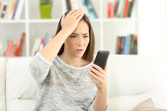 Woman making mistake on a smart phone
