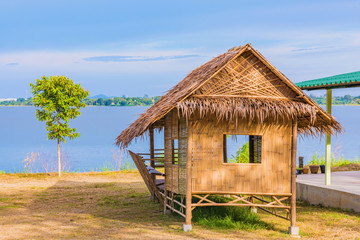 Fototapeta na wymiar Lake view with a traditional hut
