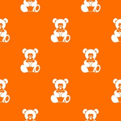 Teddy bear holding a heart pattern seamless