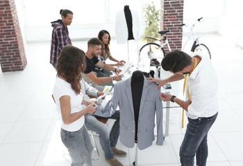 designers working on new models of clothes