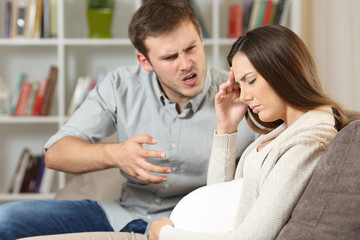 Sad pregnant woman fighting with her husband
