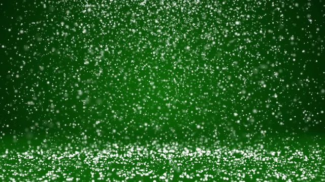 Snow fall and settle on the rotating surface. Green winter background as place for advertisement or logo, Christmas or New Year cards. Seamless looped background with DOF, copy space 6