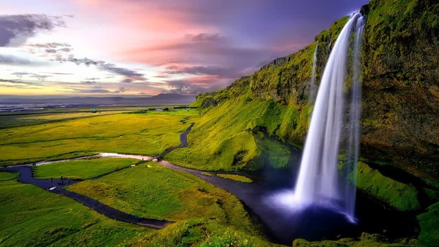 Cinemagraph of beautiful waterfall in Iceland at sunset.